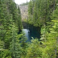 A beautiful emerald pond nestled below the Loowit Trail.