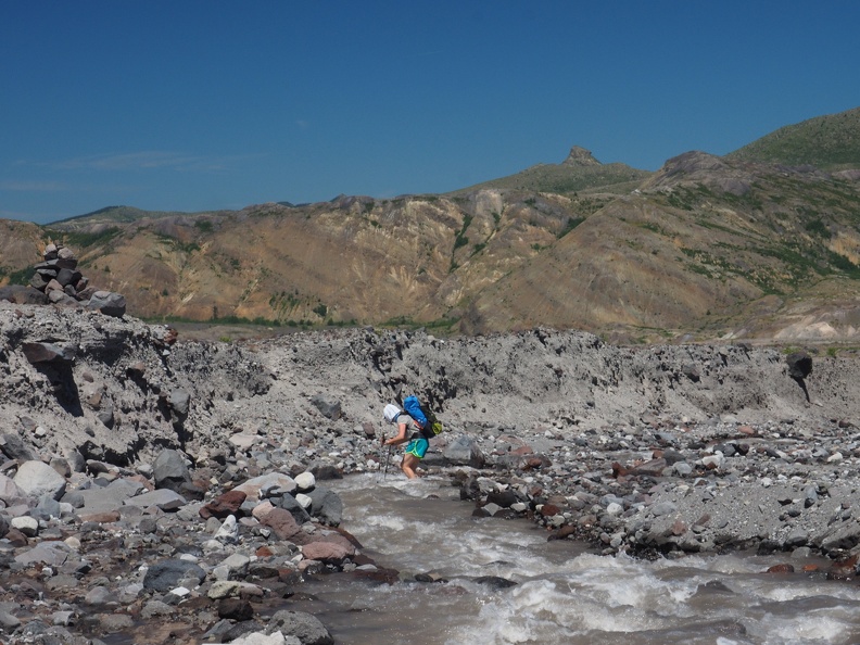 Heidi crossing the Loowit River in the afternoon. Since this comes from a glacier the water level probably doesn't vary a lot once the snowmelt finishes up. This water is somewhat silty.