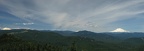 A panorama of three snow-capped mountains. From left to right, Mt. St. Helens, Mt. Rainier, and Mt. Adams from the Augspurger Mountain Trail.