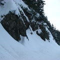 The road passes some short cliffs but trees above prevent avalanches.