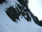 The road passes some short cliffs but trees above prevent avalanches.