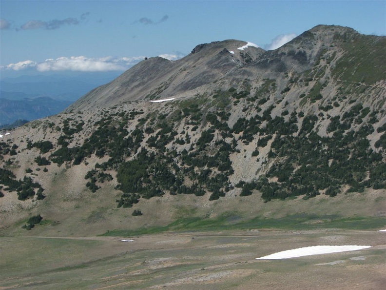 Walking up the Burroughs Mountain Trail from Frozen Lake you can see the Mt. Fremont Lookout as a tiny dark cube at the left edge of the ridge in the center of the picture.