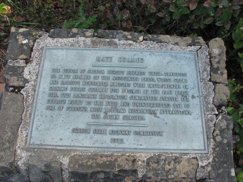 A plaque in Oswald State Park near the beach dedicated to Matt Kramer who wrote newpaper articles that led to the passage of the Oregon Beach Bill in 1967.