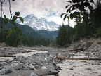 Mt. Rainier from the Nisqually River near Cougar Rock Campground. Current year's trail bridge with the previous year's trail bridge in the background.