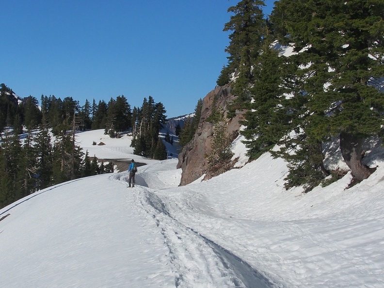 In some places the snow makes steep drifts on the road.