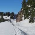 In some places the snow makes steep drifts on the road.