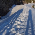 The end of the day casts long shadows along the trail.