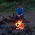 Jeremiah feeds the our campfire at Wy'East Camp.