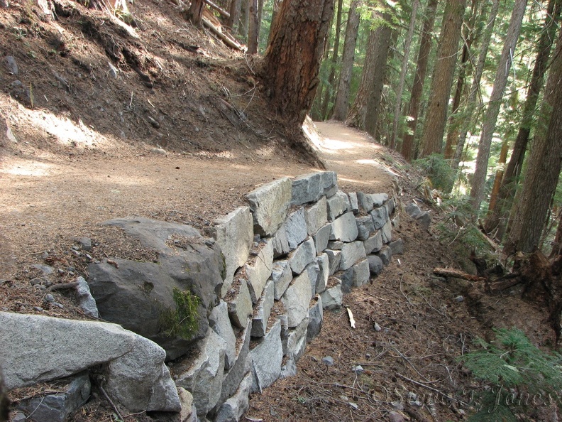 Hundreds of volunteers donated thousands of hours of work to rebuild this trail. Here is an example of a rock wall along the Glacier Basin Trail.