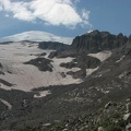 The summit of Mt. Rainier peeks out from the slopes of Glacier Basin.