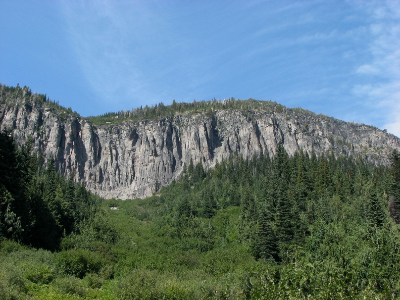 Basalt cliffs tower above the forest along the Glacier Basin Trail.