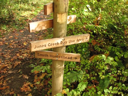 Trail sign along the Wilson River Trail showing routes and destinations along the trail.