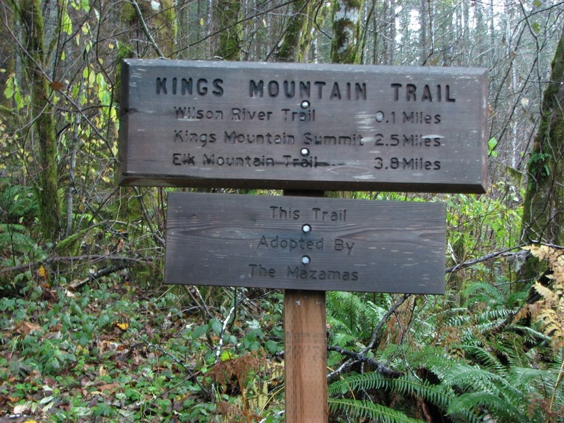 Mileage sign near the trailhead of King's Mountain Trail in the Tillamook State Forest, Oregon.