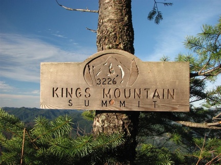 A nicely made sign at the summit King's Mountain in the Tillamook State Forest, Oregon. There is a nearby summit register to sign commemorating reaching the summit.