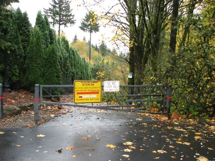 Gray gate at the trailhead for Fire Lane 3 in Portland, Oregon.