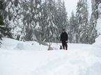 Kevin standing beside his tent after he took some of my snow blocks.