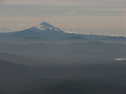 Mt. Jefferson rises above the distant mountains to the south of Mt. Hood.