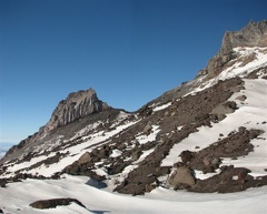 Illumination Rock is on the left side of the picture. The rock has a columnar basalt formation and lies between the Zigzag and Reid glaciers.