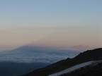 Sunrise from Lunch Counter on Mt. Adams at the 9,500 foot level with a view of Mt. St. Helens in the distance. Mt. Adams is casting its shadow on the atmosphere.