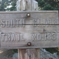 A carved wooden sign at the trailhead shows the beginning of the South Climb Trail 183 to Mt. Adams.