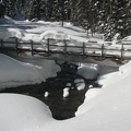 The log bridge over Clark Creek is so full of snow that it isn't useable until some of the snow melts. There are usually snow bridges just upstream from the bridge that are used.