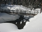 The log bridge over Clark Creek is so full of snow that it isn't useable until some of the snow melts. There are usually snow bridges just upstream from the bridge that are used.