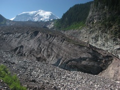 The Carbon Glacier ends at the lowest elevation of any glacier in the United States, except for Alaska. The Winthrop Glacier has to end just about at the same elevation. Mt. Rainier is the white dome in the background.