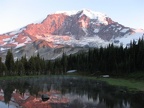 Mt. Rainier at sunset near the saddle between Moraine Park and Mystic Lake. The pond is full of snowmelt and the pond dries up quite a bit during the summer.