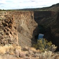 The Crooked River is the main attraction of this hike. The vegetation in the area is sparse and brushy.