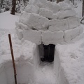 Stacking the snow blocks. Those are my feet in the entrance.