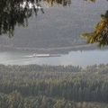 Looking down at a barge going up the Columbia River from the Ruckel Ridge Trail.