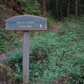 Trailhead sign for Ruckel Creek where the trail meets the Columbia State Highway Historic Trail.