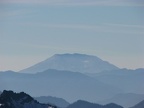 Mt. St. Helens in the distance and mountains of the Tatoosh Range from Panorama Point at Mt. Rainier National Park.