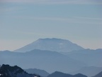 Mt. St. Helens in the distance and mountains of the Tatoosh Range from Panorama Point at Mt. Rainier National Park.