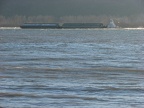 A tugboat pushes a barge against the wind and the current moving cargo upriver as far as Idaho.
