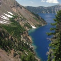 A nice view of Crater Lake showing the greener water at the shoreline as seen from Sun Notch Trail.