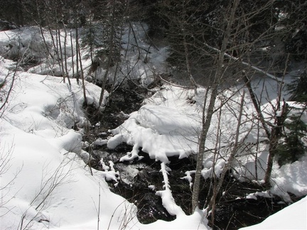 A small stream flows through a culvert under the trail at the bottom of the hill, about .5 mile from the parking lot on the Trillium Lake Trail.