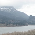 An overlook from the Horsetail Creek Trail with Beacon Rock is in the distance on the right and looks kind of like a big tooth. Wind Mountain is the pointy peak just to the right and behind Beacon Rock.