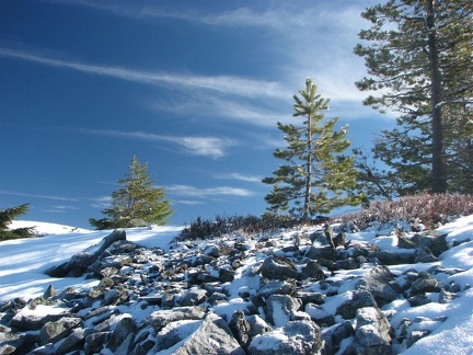 Whispy clouds and frosty rocks provide a wintery scene on the shady side of the ridge. This is on a promontory west of the Pacific Crest Trail on the way to Twin Lakes Trail.