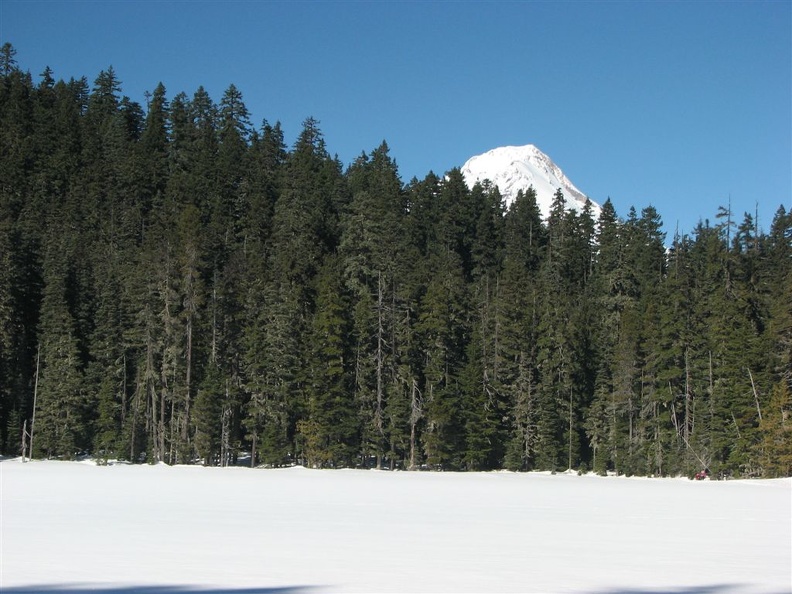 The tip of Mt. Hood can be seen from Upper Trail Lake along the Twin Lakes Trail.