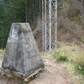 Concrete survey marker and towers for the powerline