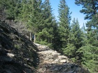 The Wind Mountain trail crosses a rocky scree field, providing views to the east.