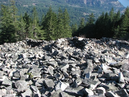 Looking east down one of the basalt scree slopes just below the summit of Wind Mountain you can see a tiny bit of the Columbia River.