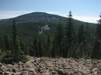 The Wyeth trail passes through a rock-strewn clearing and you can see the radio tower on top of Mt. Defiance to the east.