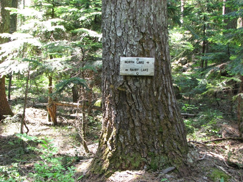 Trail junction sign for the side trail to Rainy Lake. This short side trail goes to a lake with nice views of Green Point Mountain.