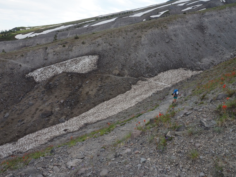 Heidi crosses one of many gullies carved out of the mountainside.