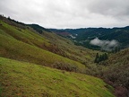 The hillsides are green in early spring.